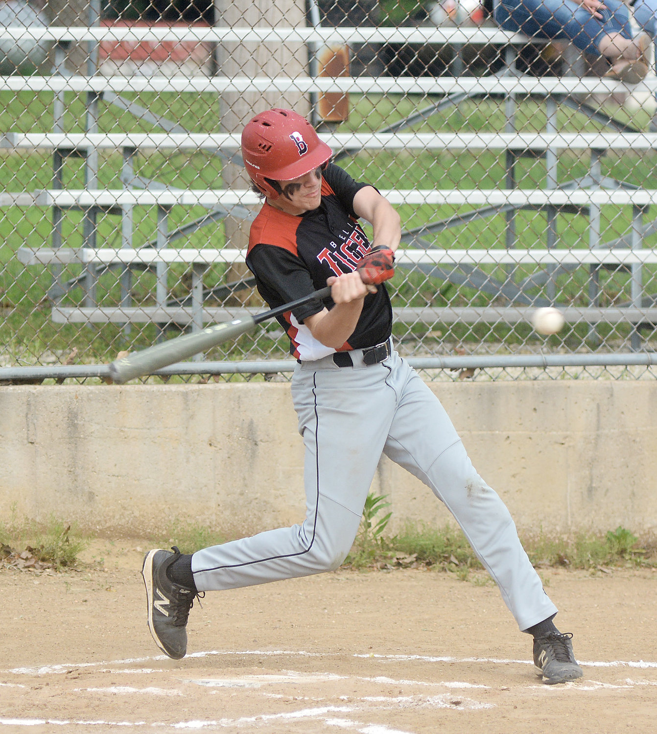 Clayton Shockley takes a swing for one of his three hits last Tuesday afternoon in Highway 89 bragging rights baseball at Belle City Park between the host Tigers and visiting Linn Wildcats.